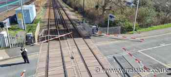 Wirral train services halted after van smashes through barriers