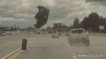 Dashcam video shows car flip mid-air on freeway after hitting a loose tire