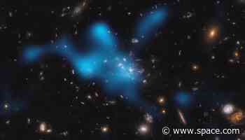 Galaxy cluster spied forming in early universe (photos, video)