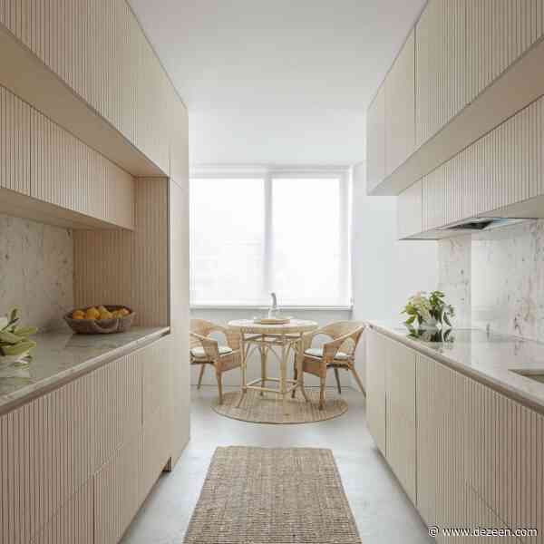 Exposed-concrete stair pulls light and views into Porto home by Tsou Arquitectos