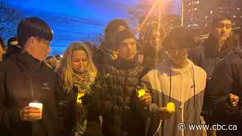 Hundreds at candlelight vigil return to Toronto subway station where teen boy fatally stabbed