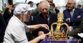 King breaks out in laughter while attempting to make traditional German cheese
