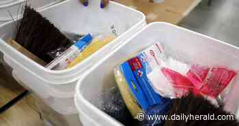 Salvation Army volunteers pack emergency flood kits
