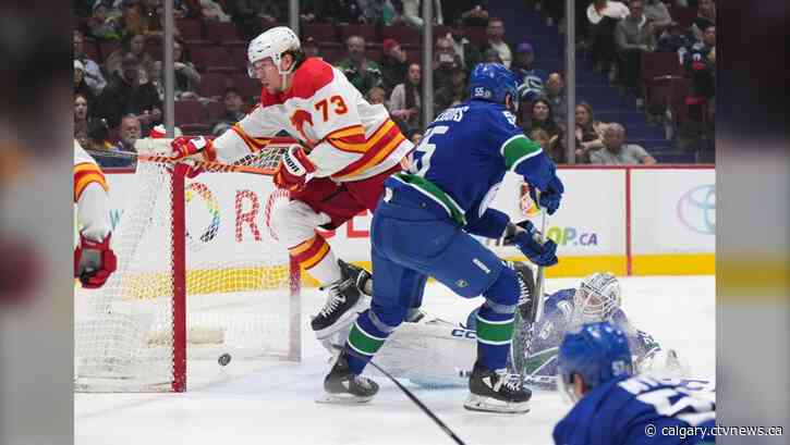 Toffoli scores twice, Flames complete comeback in 5-4 OT win against Canucks