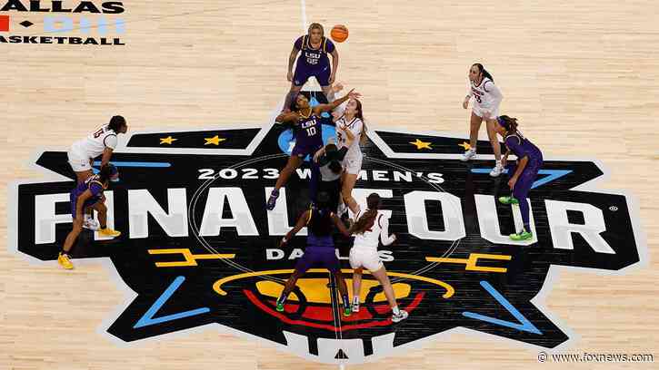 LSU cheerleaders help get stuck basketball down during Final Four matchup