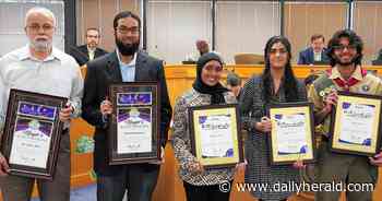 Volunteers pack meals during Ramadan for the hungry across the globe
