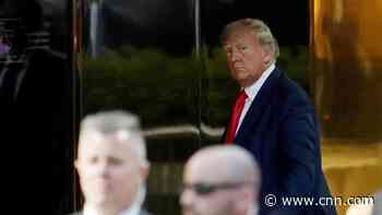 Trump in police custody ahead of historic court appearance