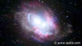 2 merging supermassive black holes spotted at 'cosmic noon' in early universe