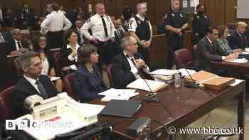 Who was sitting next to Donald Trump in the courtroom?