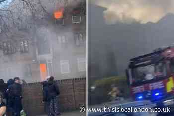 Beckton fire: Pictures show blaze in flat before woman dies