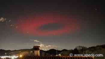 Eerie ring of red light flashes like a massive UFO above Italy. What was it?