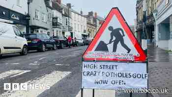 Crazy golf signs draw attention to Malmesbury potholes