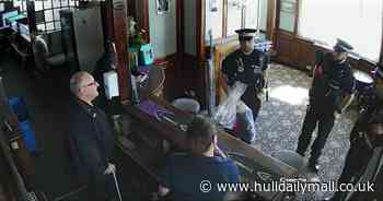 Cops storm pub and seize dolls after hate crime complaint