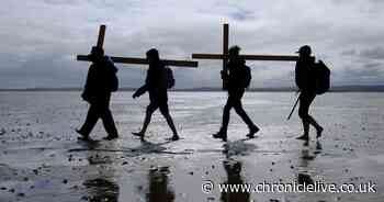 Pilgrims mark Good Friday by making their annual trip across the causeway to Holy Island