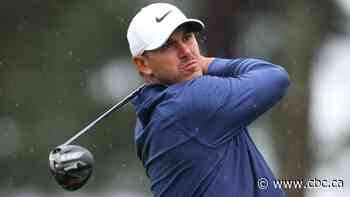 Heavy rain halts play at the Masters