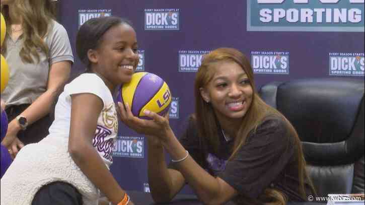 LSU star Angel Reese signing autographs for fans on Saturday