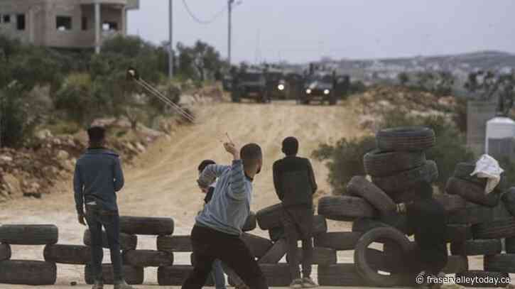 In mass rally, Israeli settlers march to West Bank outpost