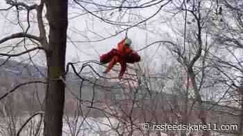 Video shows helicopter rescue of family, including 3-year-old, in Minnesota
