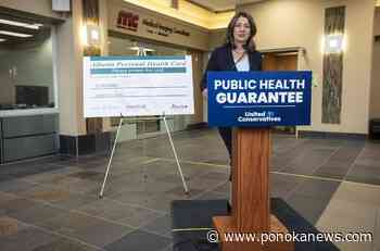 Alberta premier commits to medicare; NDP points to past musings on private options
