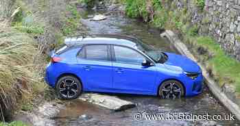 Watch moment tourist's rental car rolls head first into stream