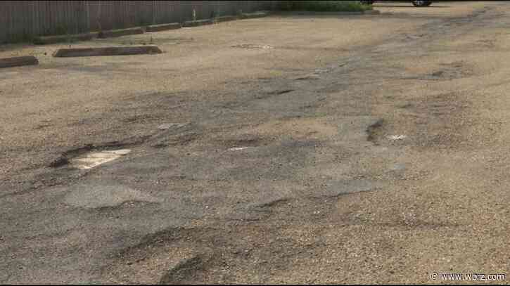 Frustrated condo tenants bump heads with manager over property's costly pothole problem