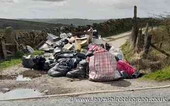 Piles of rubbish including 'bags of cannabis grow' blocks rural road