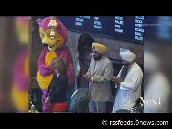 Mascot joins in prayer at the state capitol