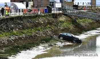 Two people stranded after blundering learner driver plunges car 17ft into harbour