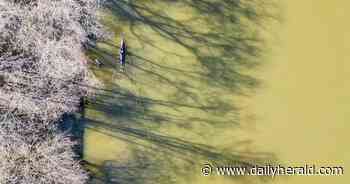 Suburban Skyview: Vibrant colors on the water during a spring sunset