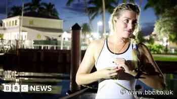 Florida mermaid collects trash and breaks records