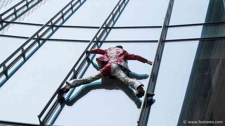 ‘French Spiderman’ free climbs Paris skyscraper to protest pension law