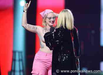 Topless Junos protester splashes pink paint at PM’s office: climate group