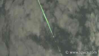 Mysterious green lasers caught on camera belong to NASA satellite (video)