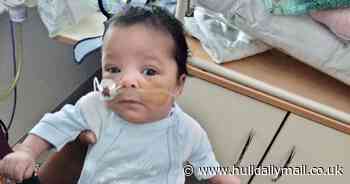 Premature baby defied the odds to survive after his heart stopped for 17 minutes