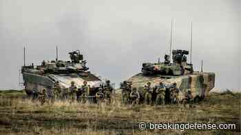 Aussies plan massive armored cuts; review charts shift to power projection