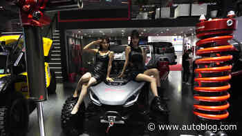 At Shanghai show, auto rivals lure drivers with in-car karaoke, crystal balls