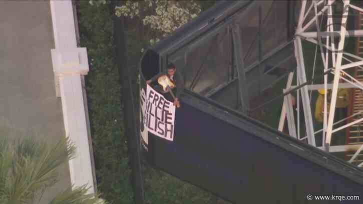 Man climbs California radio tower holding 'Free Billie Eilish' sign