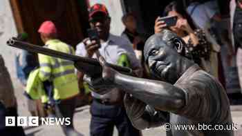Statue mocking Spain's ex-king Juan Carlos appears in Madrid