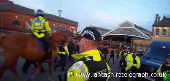 Reggie Photo filmed the officers outside Preston station