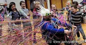 Geneva principal rides trike to reward readers