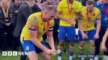 Warrington Town celebrate like Premier League champions