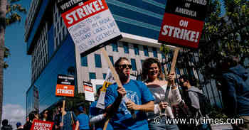 Film and TV Writers on Strike Picket Outside Hollywood Studios