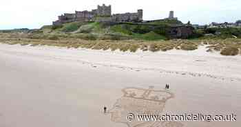King Charles sand art appears on Bamburgh Beach to mark coronation