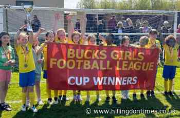 Ickenham girls celebrating cup double at football tournament