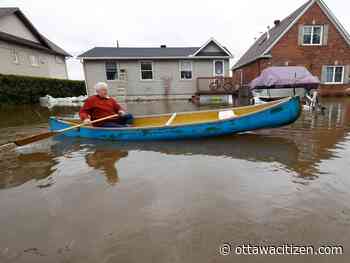 Cumberland flood veteran paddles his wife to work; officials expect break in rain, then lower flood waters