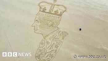 King's Coronation: Bamburgh beach is canvas for sand portrait of Charles