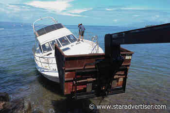 Historic birthing stone is safe as crews remove grounded boat