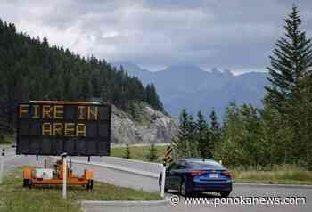 Wildfire destroys homes, police station in community in northern Alberta
