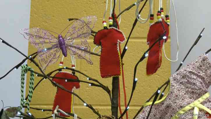 Red dresses honour memory of murdered and missing Indigenous women, girls and two-spirit people