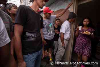View photos of migrants at Sacred Heart and Opportunity Center for the Homeless